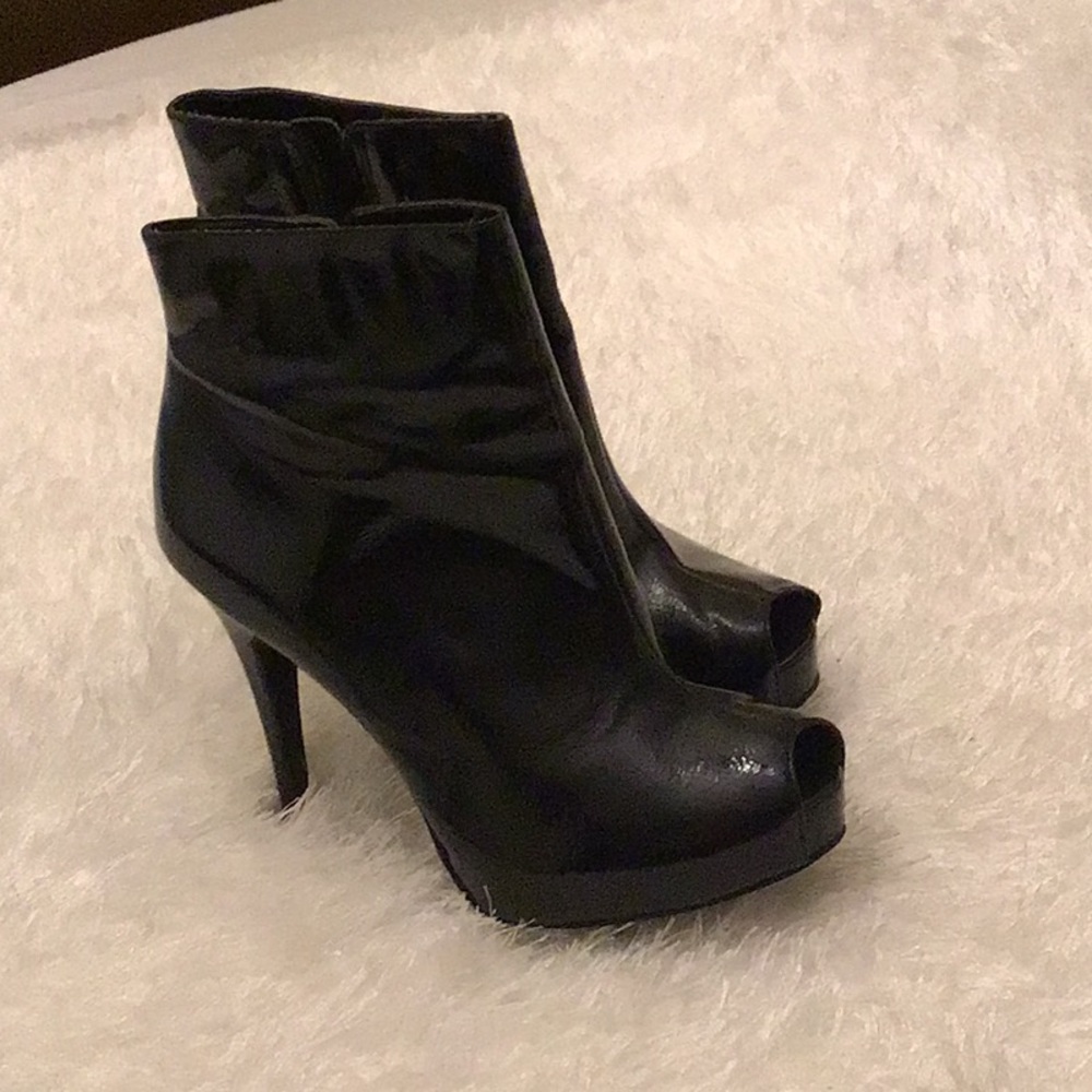 Black peep toe bootie by Carlos Santana